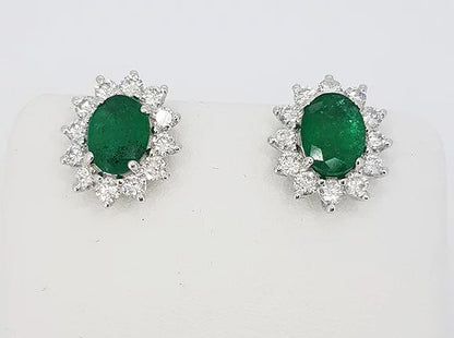 Emerald and Diamond Oval Cluster Stud Earrings; , 2.54 carats oval emeralds surrounded by 1.20cts brilliant-cut diamonds, 18ct white gold
