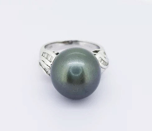 Grey South Sea Pearl and Diamond Ring; A striking 13mm grey South Sea pearl accented with diamond set shoulders. Mounted in 18ct white gold.