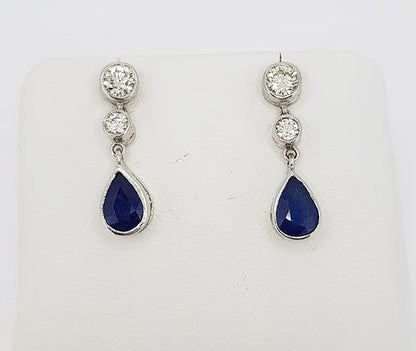 Sapphire and Diamond Drop Earrings; featuring 1.25cts pear-shaped sapphires suspended from 0.60cts brilliant cut diamonds, 18ct white gold