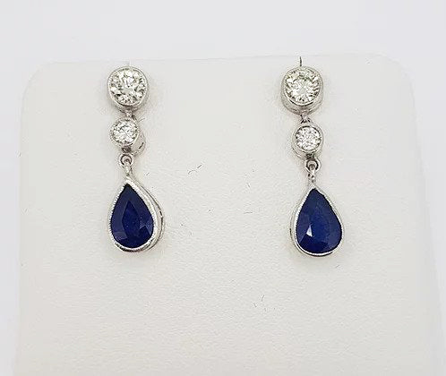Sapphire and Diamond Drop Earrings; featuring 1.25cts pear-shaped sapphires suspended from 0.60cts brilliant cut diamonds, 18ct white gold