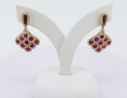 Ruby and Diamond Cluster Drop Earrings; set with 1.50cts rubies encompassed by 0.70cts diamonds, in the shape of a fan, 18ct yellow gold.