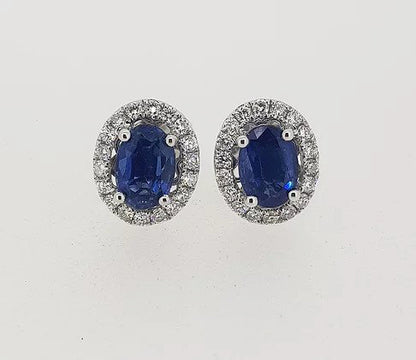 Sapphire and Diamond Oval Cluster Stud Earrings; featuring 1.93cts oval faceted sapphires surrounded by 0.47cts diamonds, in 18ct white gold.