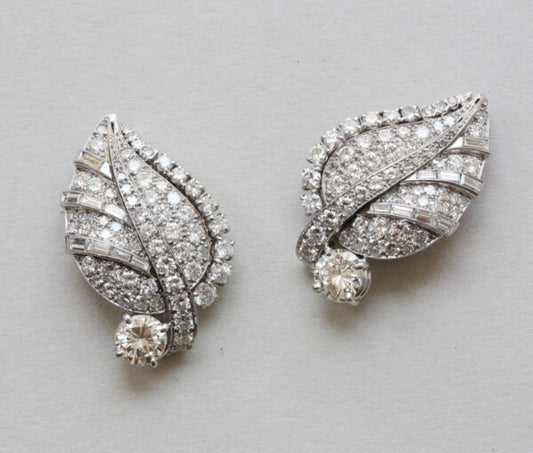 Art Deco Diamond Set Leaf Earrings; pair of platinum and white gold earrings in the shape of leaves set with 5cts baguette and brilliant-cut diamonds