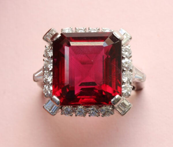 Bailey, Banks and Biddle Vintage Rubelite, Diamond and Platinum Square Ring; 12 carat step-cut rubelite bordered with mixed-cut diamonds, Signed, Circa 1950