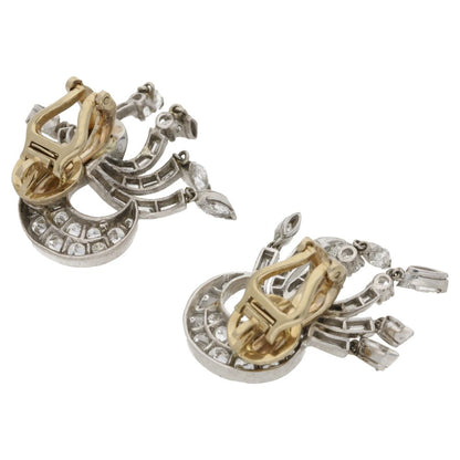 Diamond drop clip-on earrings set in platinum and gold.