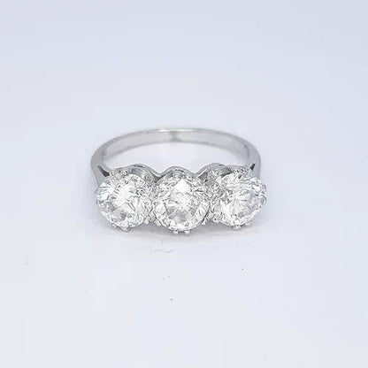 3.06ct Diamond Three Stone Ring; impressive diamond trilogy ring featuring three circular diamonds, 3.06 carat total, in 18ct white gold