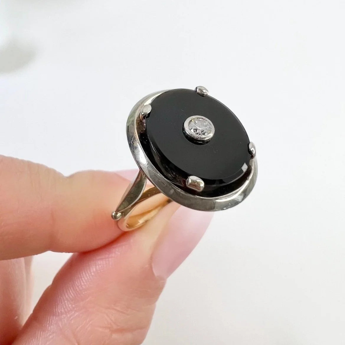 Art Deco 18 Carat Two Colour Gold Oval Onyx and Diamond Halo Ring, Circa 1920