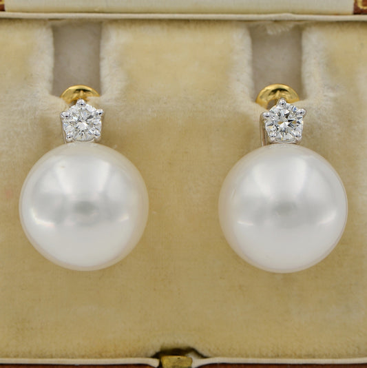 South Sea Pearl and Diamond Earrings, Two large 14.5mm South Sea pearls suspended from sparkling round brilliant-cut diamond solitaire studs in 18ct white and yellow gold