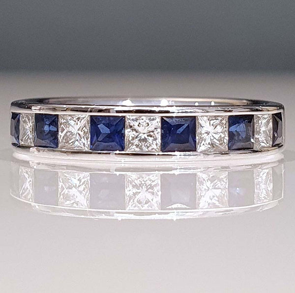 Princess Cut Diamond Sapphire and Diamond Half Eternity Ring, 11 alternating princess-cut diamonds and sapphires in 18ct white gold band