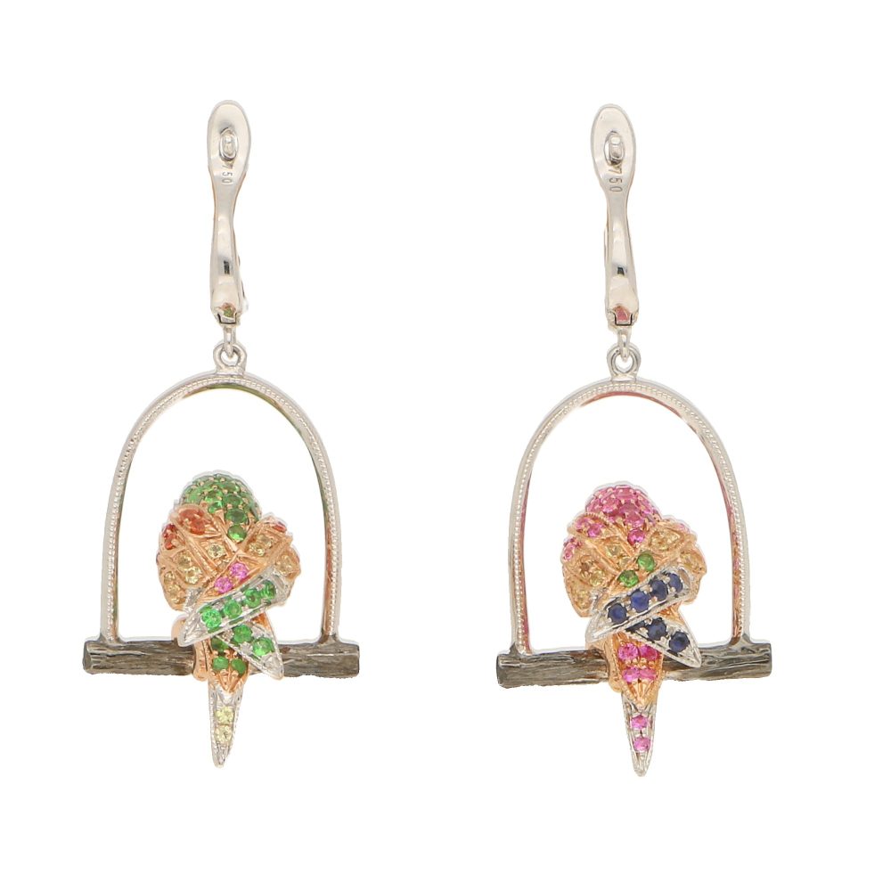 Tsavorite Garnet and Fancy Colour Sapphire Parrot Earrings, each parrot is perched on a white gold swing roost and set with blue, pink, orange and yellow sapphires, rubies, tsavorite garnets and diamonds
