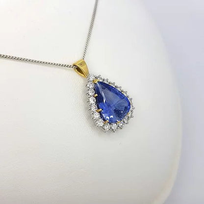 Natural Sapphire and Diamond Pear Cluster Pendant; featuring a 8.58 carat natural pear cut sapphire from Madagascar with 2cts brilliant diamond surround, Certified