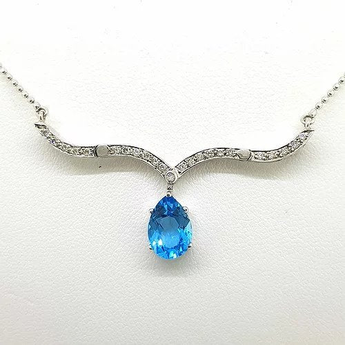 Blue Topaz and Diamond Articulated Illusions Pendant Necklace; with moveable diamond set sections to wear either as a cluster pendant or a drop necklace, in 18ct white gold