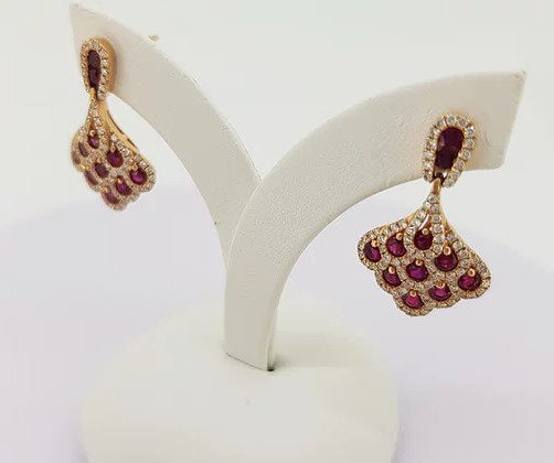 Ruby and Diamond Cluster Drop Earrings; set with 1.50cts rubies encompassed by 0.70cts diamonds, in 18ct yellow gold.