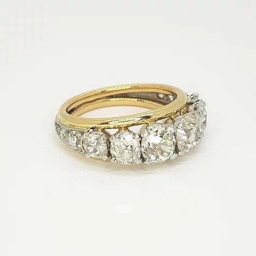 Vintage 1960s Bespoke 2.50ct Old Cut Diamond Ring; featuring eleven graduated old-cut diamonds that taper to the shoulders, in open white gold collet settings, edged with 18ct yellow gold