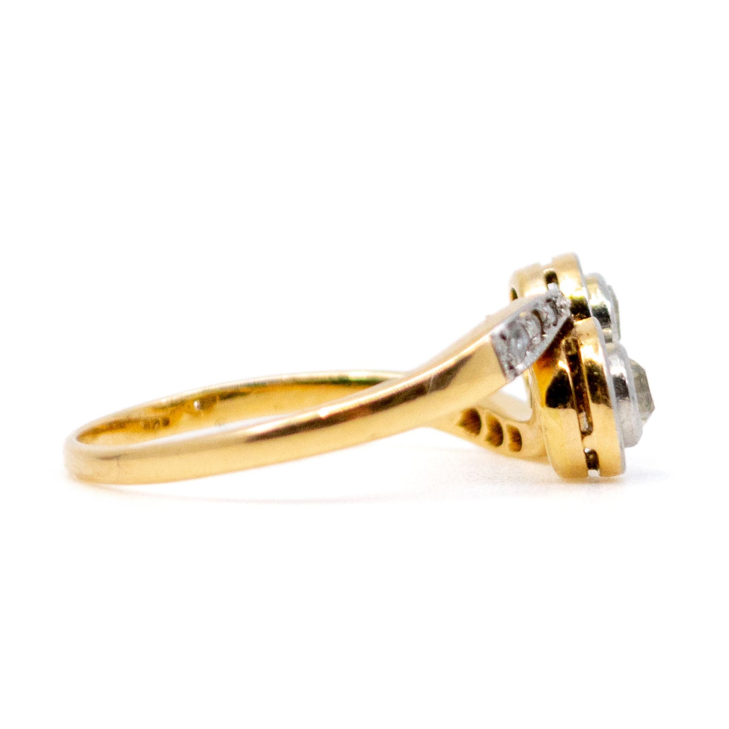 A two stone diamond crossover ring in yellow and white gold