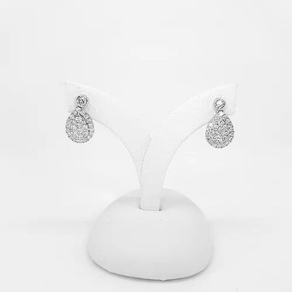 Pear Shaped Diamond Cluster Drop Earrings; brilliant cut diamonds arranged into pear-shaped clusters, suspended from round brilliant-cut diamond studs, 0.93 carat total, in 18ct white gold