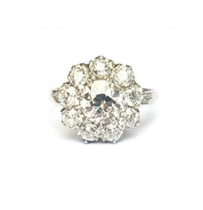 Old Cut Diamond Cluster Ring in Platinum; set with 3.50 carats of old cut diamonds, claw set with a low profile to the finger, colour H, clarity VS2