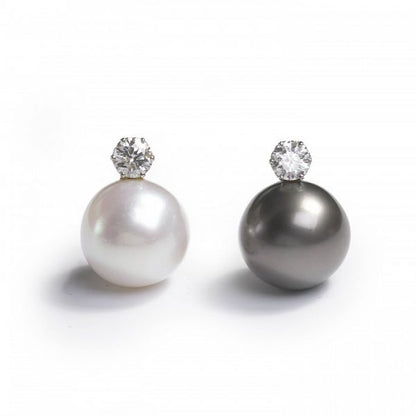 South Sea Pearl and Diamond Earrings; one black and one white South Sea cultured pearl, each topped with a round brilliant-cut diamond, 2.20 carat total, in white gold