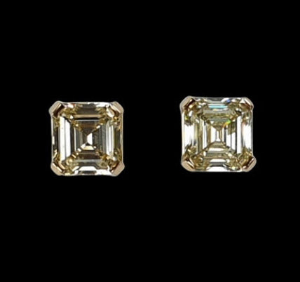 Pair of Asscher Cut Yellow Diamond Stud Earrings; set with a 1.70 carat and 1.54 carat asscher-cut yellow diamond, 3.24 carat total, VS1 clarity, in 18ct yellow gold