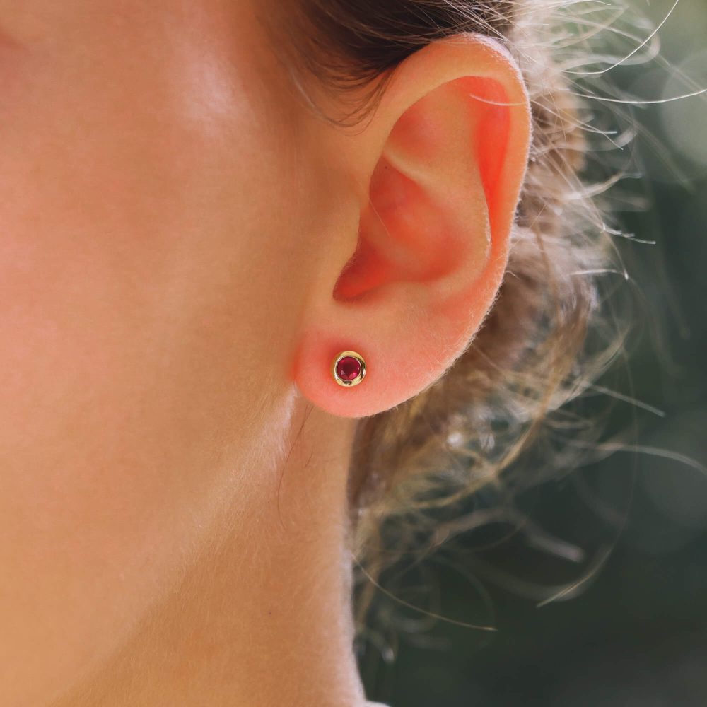 Ruby stud earrings set in 18 carat yellow gold.