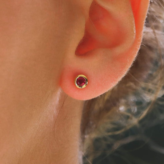 Ruby stud earrings set in 18 carat yellow gold.