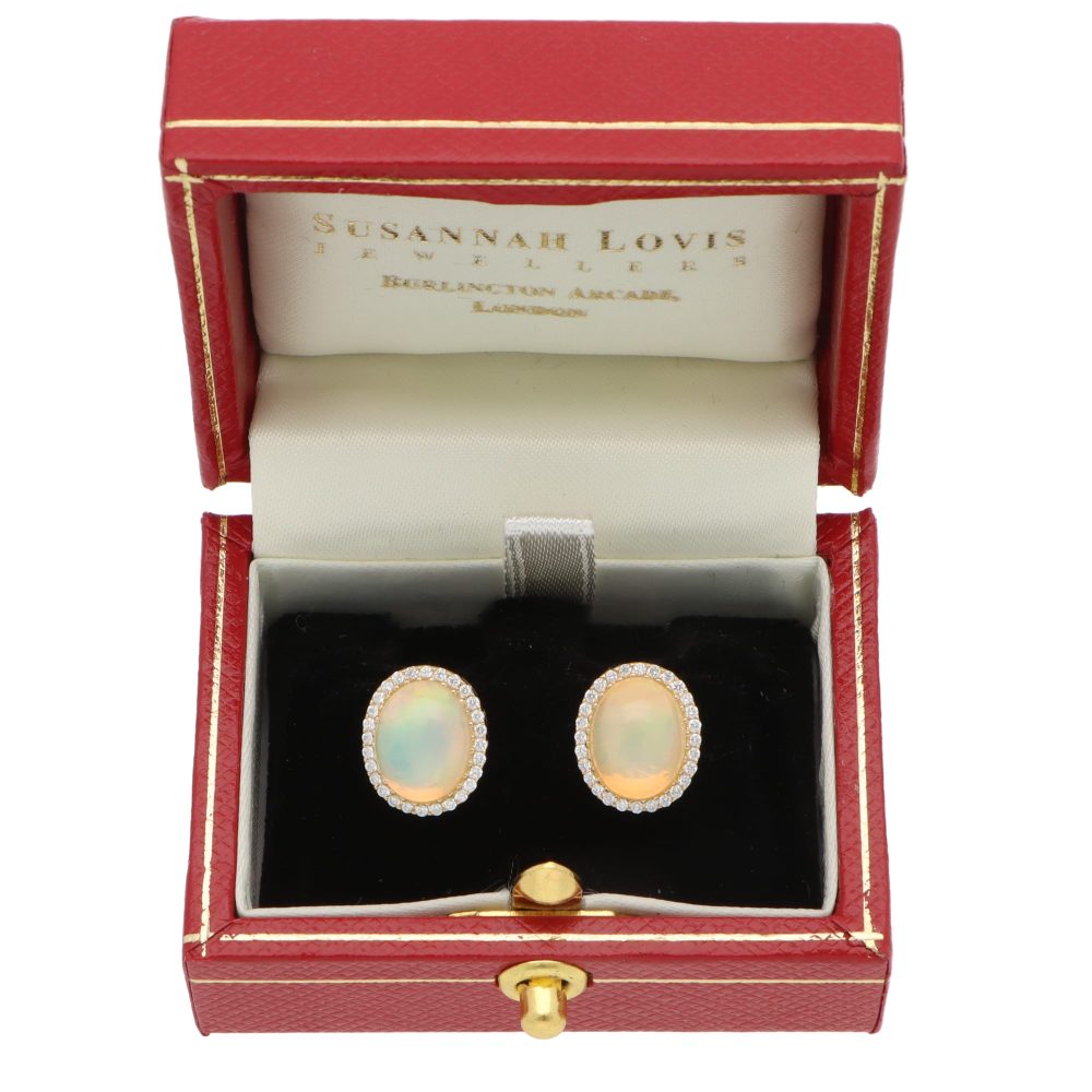 Opal and diamond stud earrings in gold.