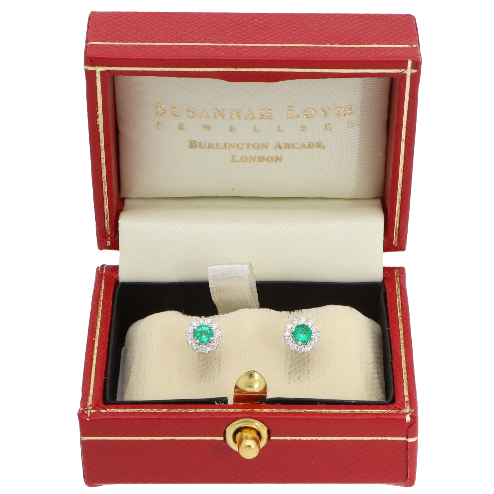 A pair of emerald and diamond round cluster stud earrings in white gold, in a red earring box, on a white background