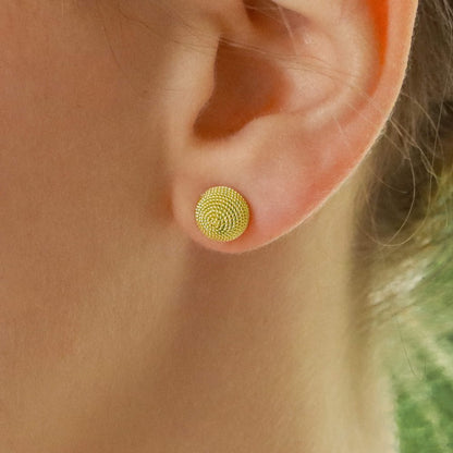 Woven dome gold stud earrings.