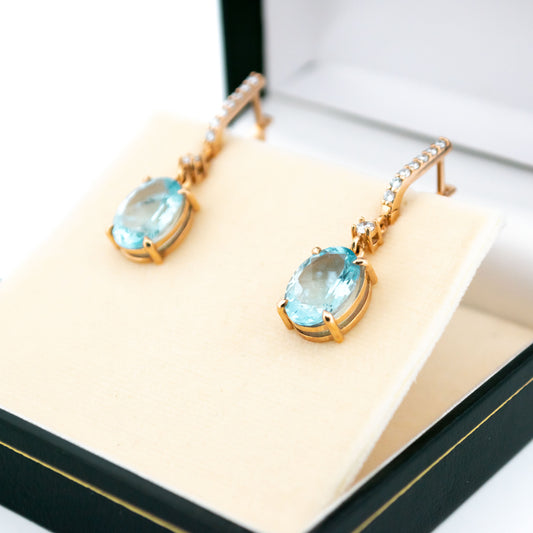 A pair of aquamarine and diamond drop earrings in yellow gold, in a box