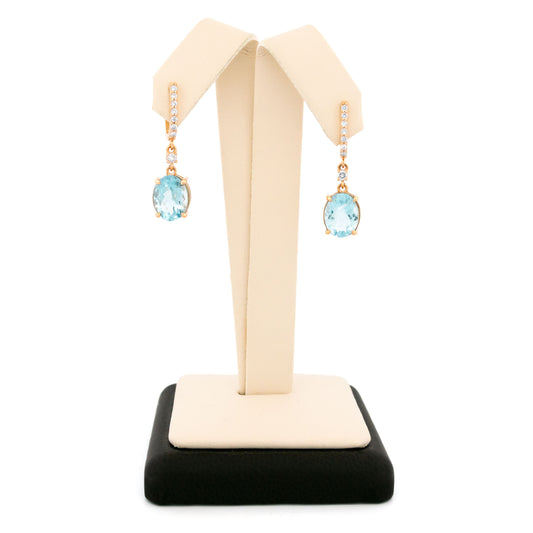 A pair of aquamarine and diamond drop earrings in yellow gold