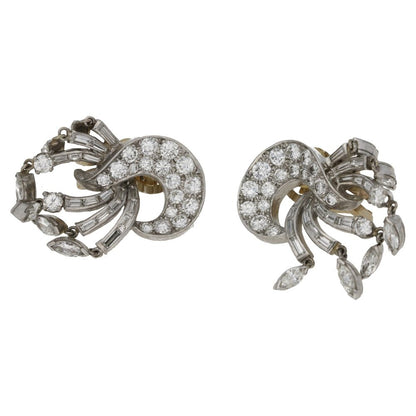 Diamond drop clip-on earrings set in platinum and gold.