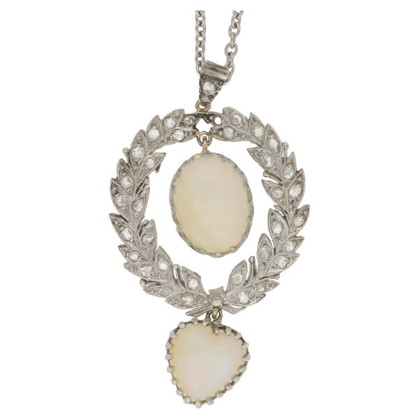 Antique Belle Epoque Opal and Diamond Wreath Pendant; oval cabochon white opal within rose-cut diamond-set platinum wreath suspending a heart-shape cabochon white opal, in platinum and gold
