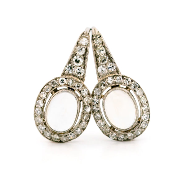 A pair of moonstone and diamond drop earrings in platinum and gold