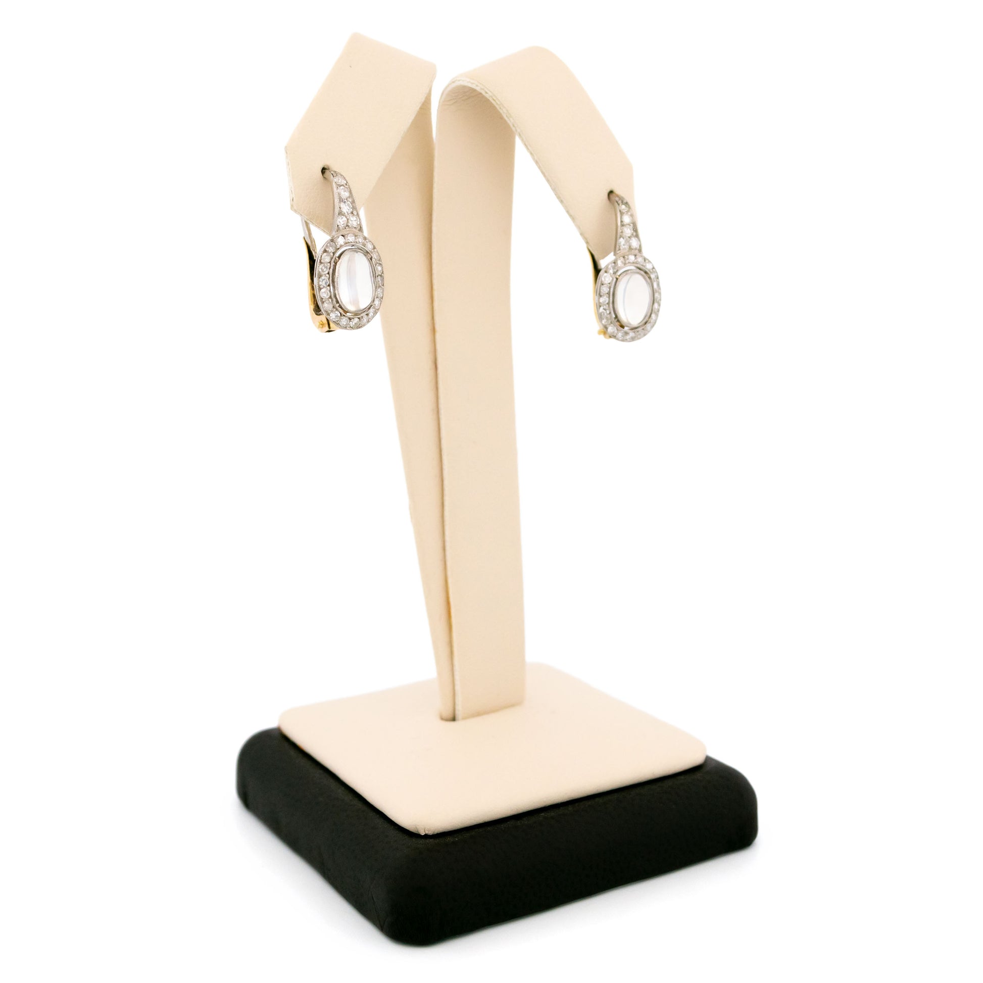 A pair of moonstone and diamond drop earrings in platinum and gold