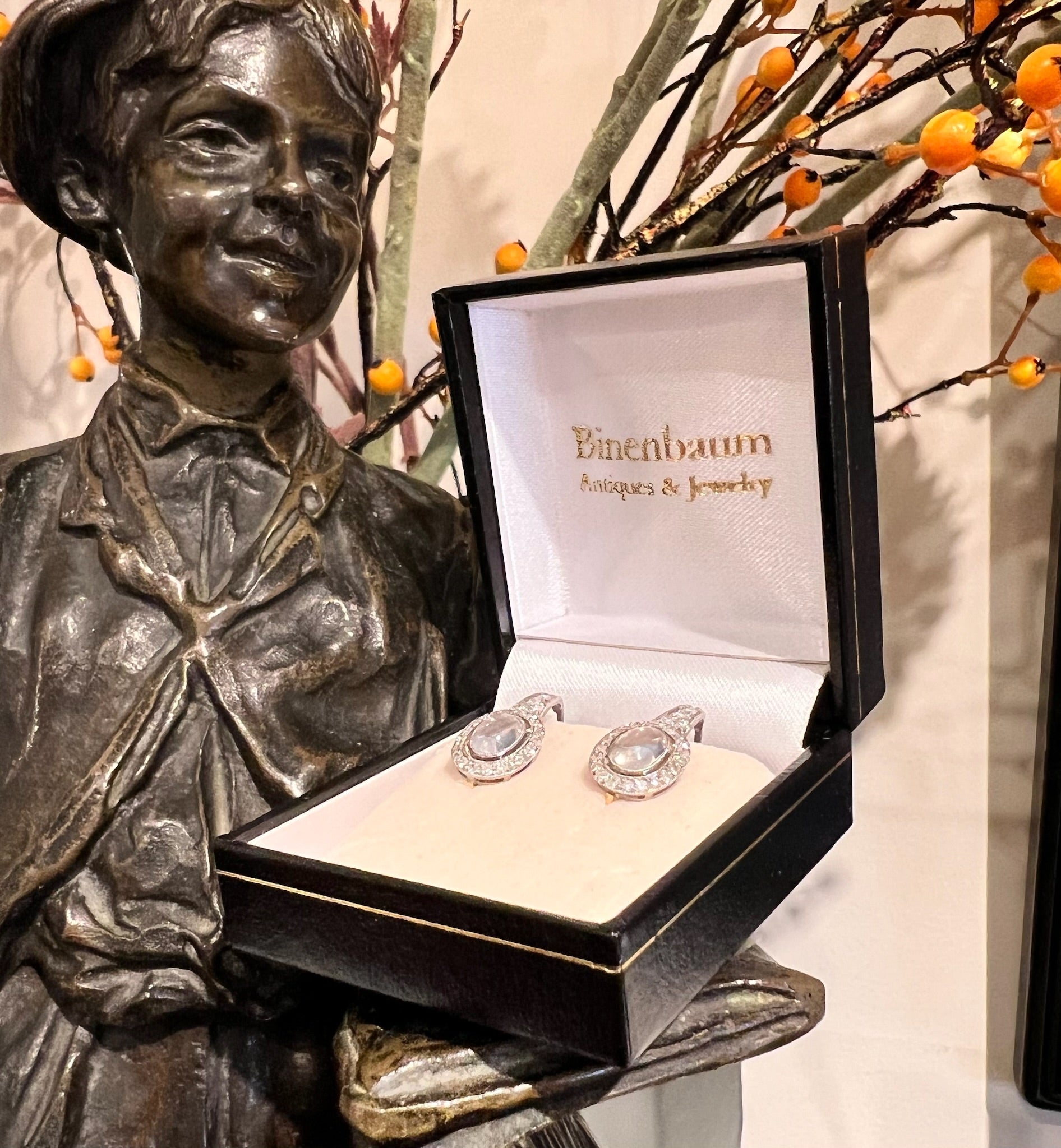 A pair of moonstone and diamond drop earrings in platinum and gold, in a box