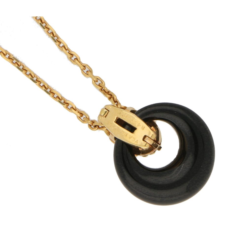 Van Cleef & Arpels onyx disk pendant necklace in gold.