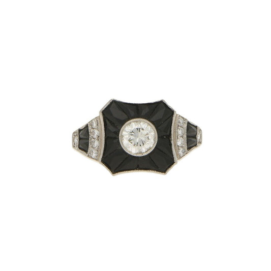 0.50ct Diamond and Onyx Target Ring in Platinum; central 0.50 carat round brilliant-cut diamond surrounded by calibre-French-cut onyx, tapered shoulders embellished with diamonds and onyx flowing to a solid D-shape platinum shank