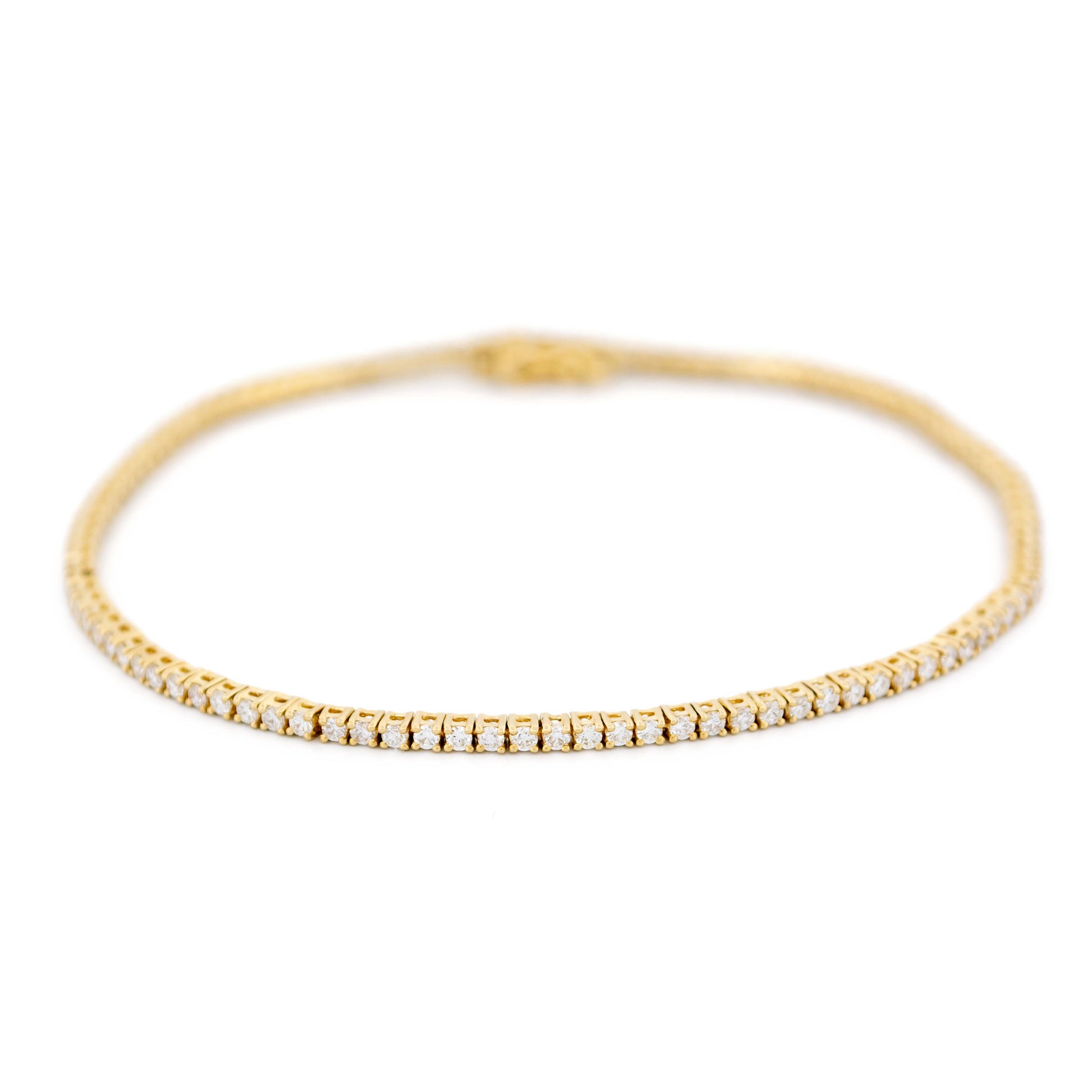 A yellow gold diamond line bracelet