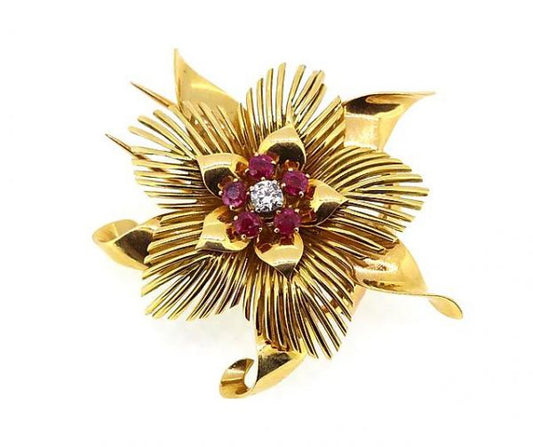 Vintage French Ruby and Diamond set 18ct Yellow Gold Floral Brooch; 18ct gold flower brooch set with one brilliant-cut diamond and five round-cut rubies.