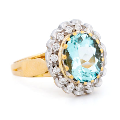 18 Carat Yellow and White Gold Aquamarine and Diamond Oval Cluster Ring