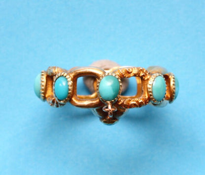 Antique Georgian Turquoise and Gold Ring; set with round cabochon cut turquoises from which suspends a small heart shaped locket. England, Circa 1840