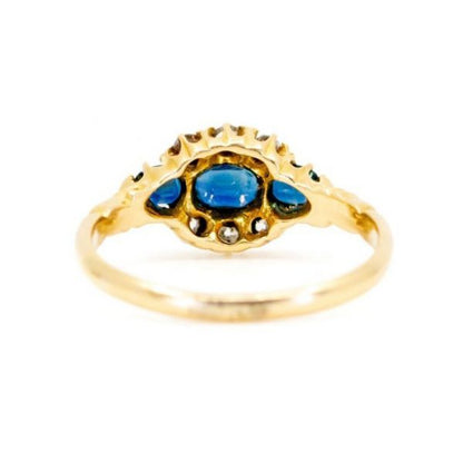 Antique Victorian Sapphire and Old Cut Diamond Ring; three sapphires surrounded by old mine-cut diamonds, 1.18 carat total, set in 18ct yellow gold.