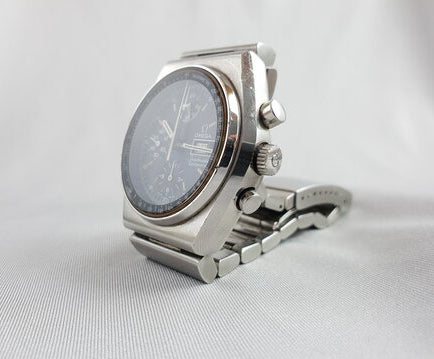 Vintage 1970's Omega Speedmaster 40mm Automatic Chronograph Steel Watch; black dial, protected by mineral crystal, bar-style steel bracelet strap