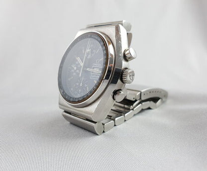 Vintage 1970's Omega Speedmaster 40mm Automatic Chronograph Steel Watch; black dial, protected by mineral crystal, bar-style steel bracelet strap