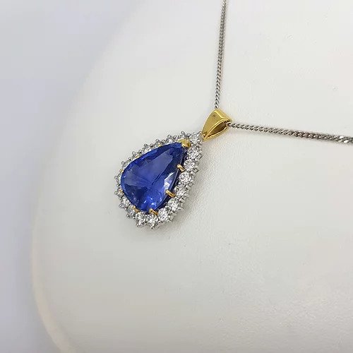 Natural Sapphire and Diamond Pear Cluster Pendant; featuring a 8.58 carat natural pear cut sapphire from Madagascar with 2cts brilliant diamond surround, Certified