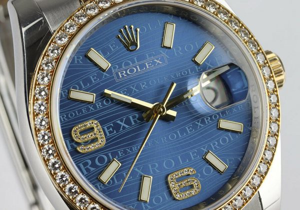 Rolex Mens Datejust 116243 Steel and Gold 36mm Automatic Watch, blue dial, diamond bezel, Two diamond Arabic numerals, screw-down crown, sapphire crystal, Oyster bracelet. With Rolex box and papers, tag and bezel protector.