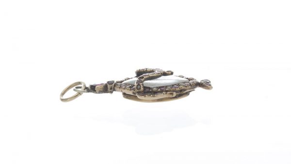 Antique Georgian Rock Crystal, Ruby and Pearl Locket Pendant; central rock crystal locket surrounded with rubies and seed pearls, 15ct yellow gold, 18th century, Circa 1760s