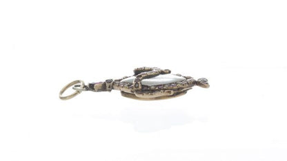 Antique Georgian Rock Crystal, Ruby and Pearl Locket Pendant; central rock crystal locket surrounded with rubies and seed pearls, 15ct yellow gold, 18th century, Circa 1760s