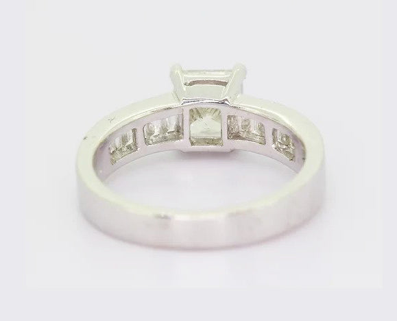 1.70ct Princess Cut Diamond Engagement Ring, four-claw set, accented with 0.57ct baguette-cut diamond set shoulders, 18ct white gold.