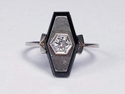Art Deco French Old Cut Diamond and Onyx Lozenge Plaque Ring; hexagonal ring with central 0.25ct old cut diamond on a matt ground with a fine onyx border. Set in white gold, Circa 1925